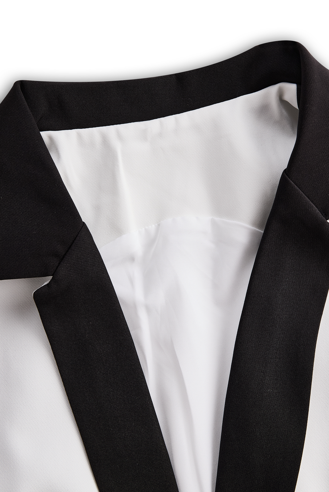 Sleek White Jumpsuit With Dual Button Detail And Black Lapel